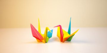 two yellow-red-blue papers