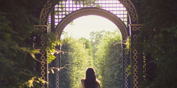 woman walking alone on pathway