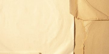 white printer paper on brown textile