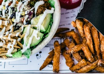 chicken wings near vegetable dish