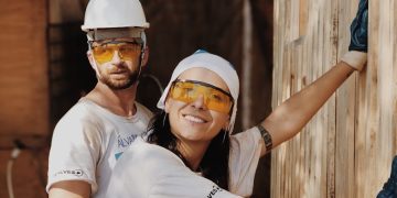 woman in white shirt wearing white helmet