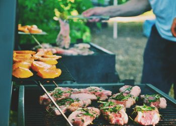 person grilling meat