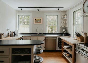 a kitchen with a clock on the wall
